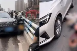 吉普车失控跨线将骑手撞下高架桥