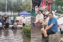 河南暴雨 宾客坐积水中吃席
